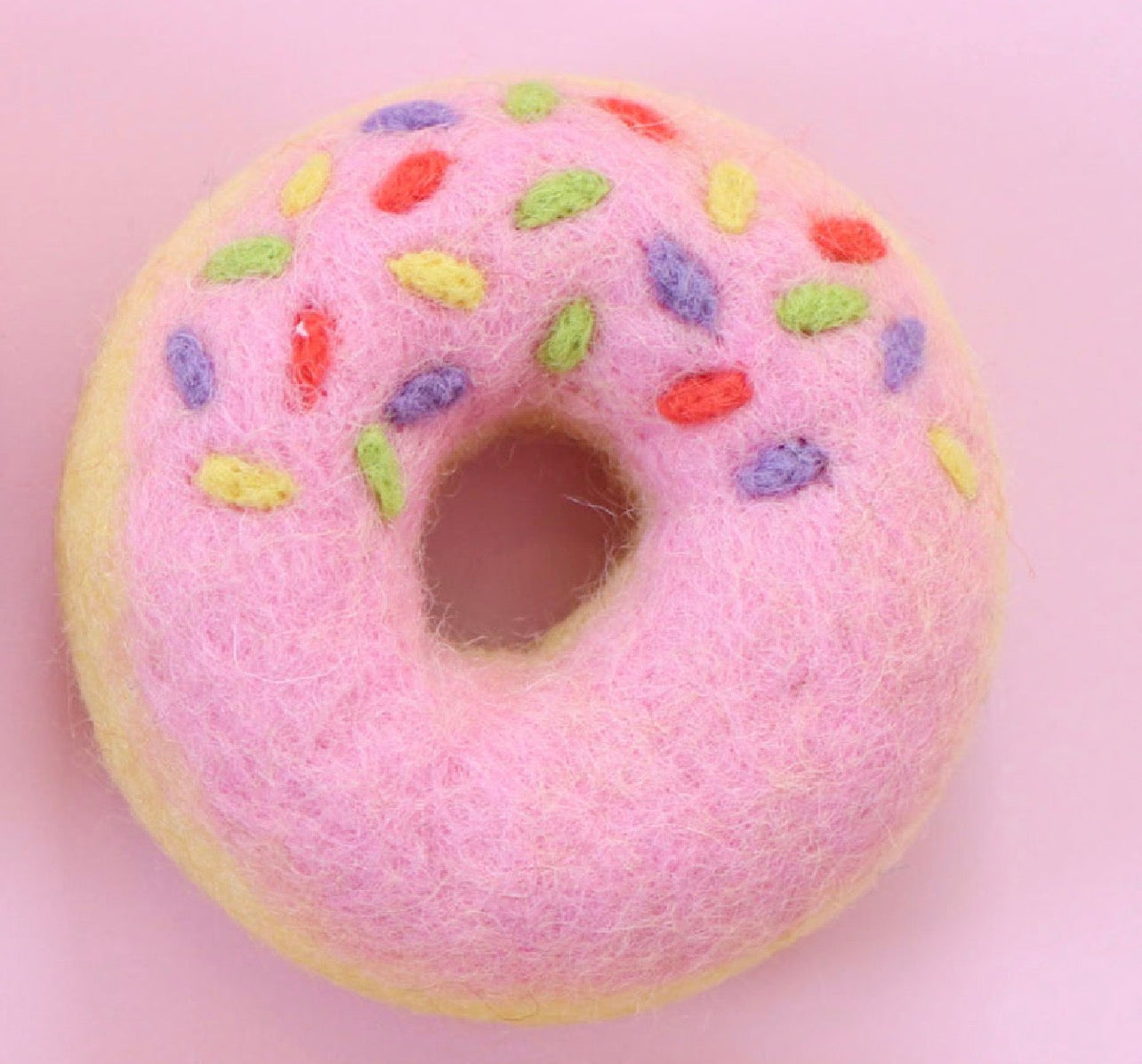 Pink side sprinkle donut